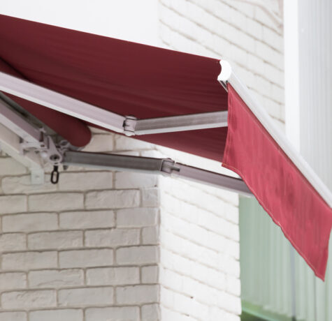 Close up of a red retractable awning