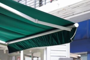 green retractable awning needs replacement