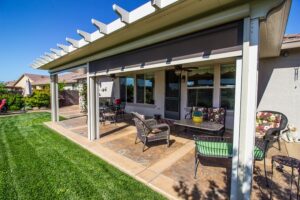 Modern outdoor patio with furniture and retractable screen